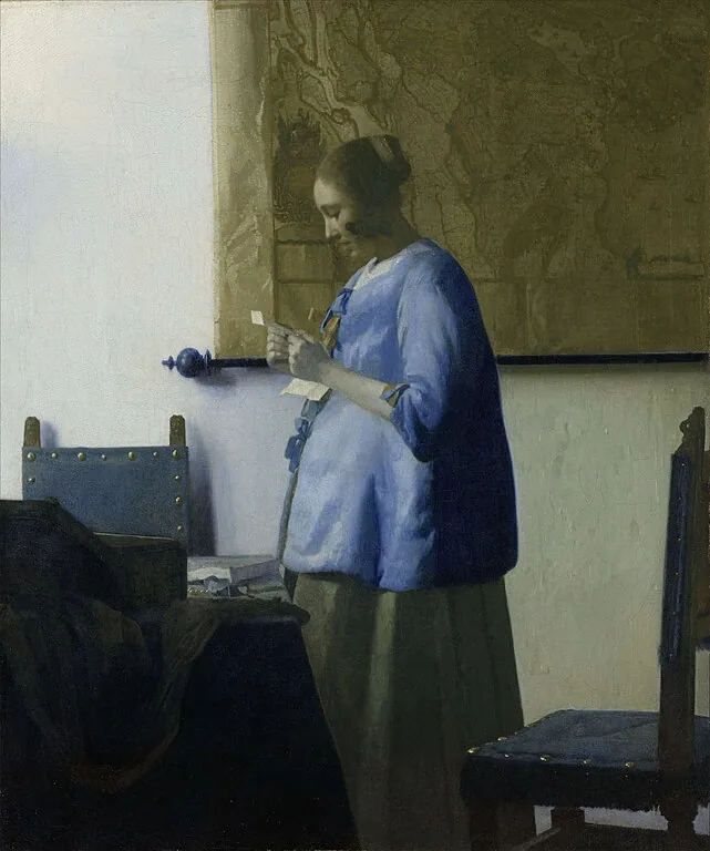 Woman in Blue Reading a Letter by Johannes  Vermeer, 1664